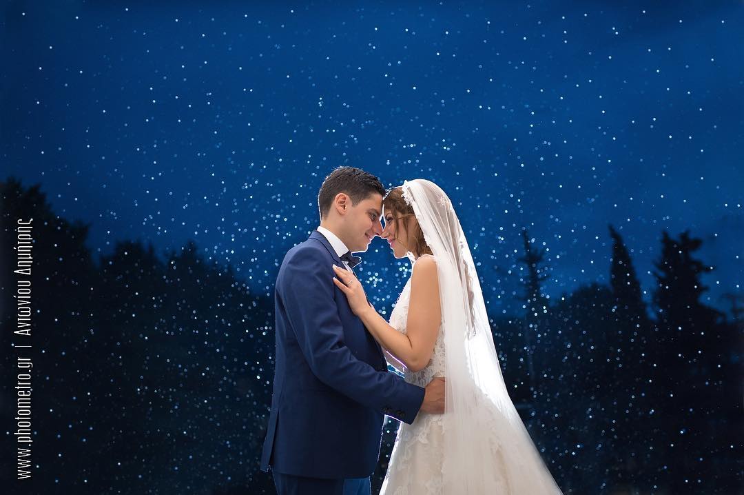 Bride and groom under a starry night sky