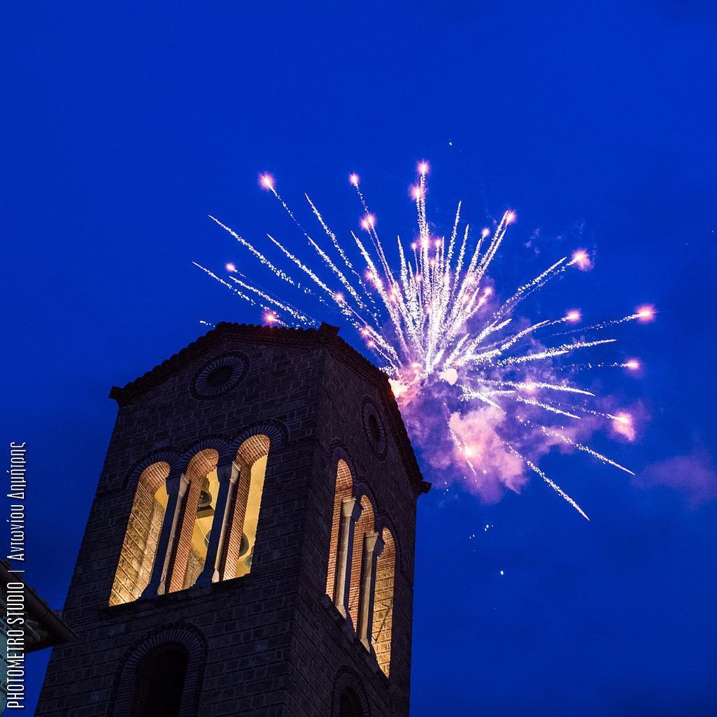 Fireworks over a church bell tower